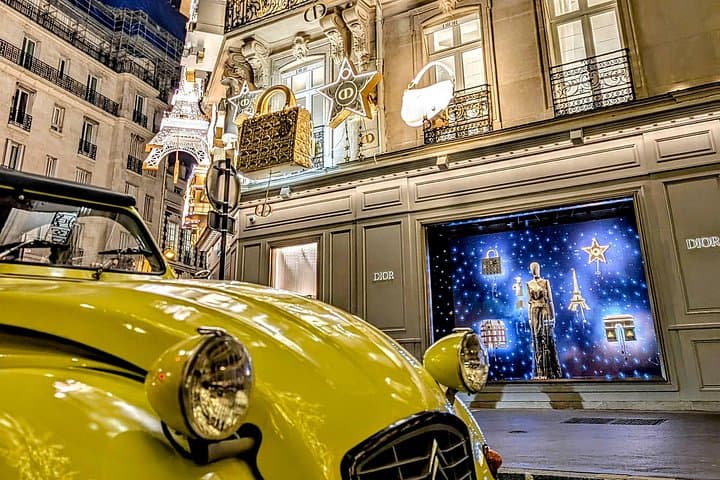 The magical illuminations of Christmas in Paris in an antique car!
